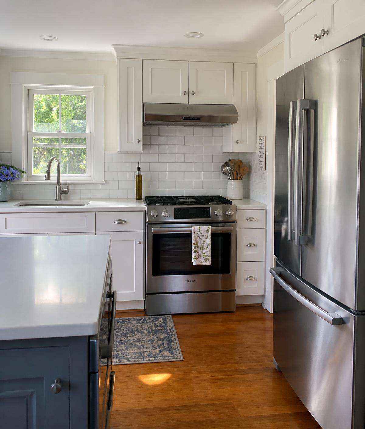 Spotless white kitchen in a Massachusetts home after a professional cleaning